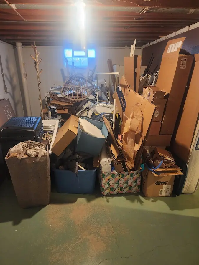 Roll-off dumpster container at job site for Yard Waste Dumpster Rental in Eastwood